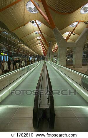 Moving sidewalk at Madrid Barajas Airport (MAD), Spain's busiest airport View Large Photo Image Stock Image - Moving sidewalk at Madrid Barajas Airport (MAD), Spain's busiest airport. Fotosearch