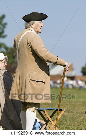 Stock Photo - Older man looks on at the 225th Anniversary of the Victory at Yorktown, a reenactment of the siege of Yorktown, where General George Washington commanded 17, 600 American troops and French Comte de Rochambeau lead 5500 French troops, together defeating Gen. Fotosearch