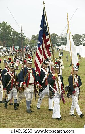 Stock Image - Patriot soldiers march to Surrender Field as part of the 225th Anniversary of the Victory at Yorktown, a reenactment of the siege of Yorktown, where General George Washington commanded 17, 600 American troops and French Comte de Rochambeau lead 5500 French. Fotosearch