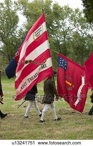 Patriot soldiers march with flags to Surrender Field as part of the 225th Anniversary of the Victory at Yorktown, a reenactment of the siege of Yorktown, where General George Washington commanded 17, 600 American troops and French Comte de Rochambeau lead View Large Photo Image Stock Image - Patriot soldiers march with flags to Surrender Field as part of the 225th Anniversary of the Victory at Yorktown, a reenactment of the siege of Yorktown, where General George Washington commanded 17, 600 American troops and French Comte de Rochambeau lead . Fotosearch