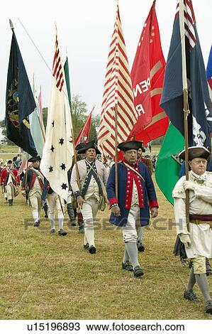 Patriot soldiers with flags march to Surrender Field as part of the 225th Anniversary of the Victory at Yorktown, a reenactment of the siege of Yorktown, where General George Washington commanded 17, 600 American troops and French Comte de Rochambeau lead View Large Photo Image Stock Image - Patriot soldiers with flags march to Surrender Field as part of the 225th Anniversary of the Victory at Yorktown, a reenactment of the siege of Yorktown, where General George Washington commanded 17, 600 American troops and French Comte de Rochambeau lead . Fotosearch