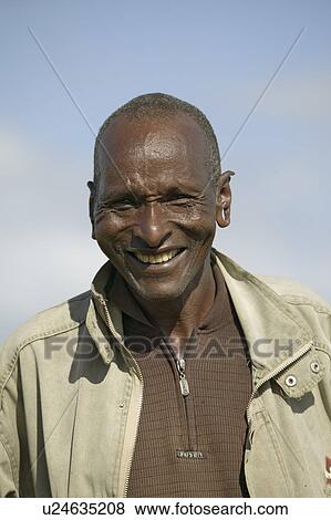 Stock Photo - Portrait of Masai man with pierced ears at Lewa Wildlife Conservancy in North Kenya, Africa. Fotosearch