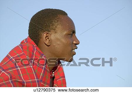 Portrait of Masai Warrior in traditional red toga at Lewa Wildlife Conservancy in North Kenya, Africa View Large Photo Image Stock Photography - Portrait of Masai Warrior in traditional red toga at Lewa Wildlife Conservancy in North Kenya, Africa. Fotosearch