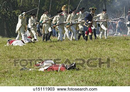 Stock Image - Re-enactment of Attack on Redoubts 9 & 10 where the major infantry action of the siege of Yorktown took place. General Washington's armies captured two British fortifications, Endview Plantation (circa 1769), near Yorktown Virginia. Part of the 225th anni. Fotosearch