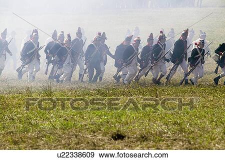 Stock Photo - Re-enactment of Attack on Redoubts 9 & 10 where the major infantry action of the siege of Yorktown took place. General Washington's armies captured two British fortifications, Endview Plantation (circa 1769), near Yorktown Virginia. Part of the 225th an. Fotosearch