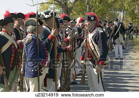 Stock Photo - Re-enactment of Attack on Redoubts 9 & 10 where the major infantry action of the siege of Yorktown took place. General Washington's armies captured two British fortifications, Endview Plantation (circa 1769), near Yorktown Virginia. Part of the 225th an. Fotosearch