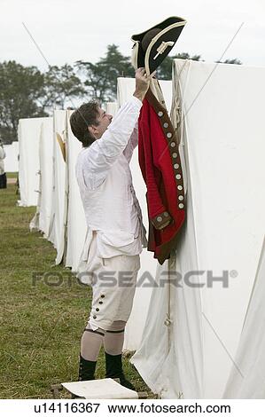 Stock Photo - Re-enactment of Revolutionary War Encampment demonstrates camp life of Continental Army as part of the 225th Anniversary of the Siege of Yorktown, Virginia, 1781, ending the American Revolution with the defeat of the British Army and Lord Cornwallis surre. Fotosearch