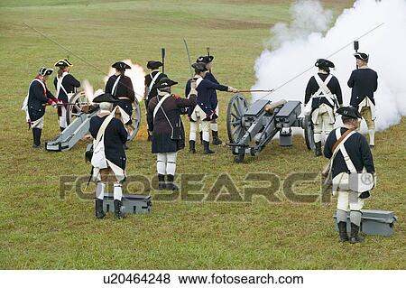 Stock Photo - Revolutionary War re-enactors re-create the cannon fire and subsequent cease-fire of the British army, in which they flew the white flag requesting a truce, bringing an end to the bombardment by the Allied armies and beginning the negotiations to surrende. Fotosearch