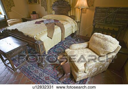 Riding boots and outfit displayed in guest room of Hearst Castle, San Simeon, California View Large Photo Image Stock Image - Riding boots and outfit displayed in guest room of Hearst Castle, San Simeon, California. Fotosearch