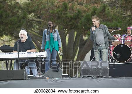Picture - Rock stars Michael McDonald and Kenny Loggins perform in outdoor concert in Ventura, California for the Ventura Hillsides Conservancy and the Ventura Hillsides Music Festival. Fotosearch