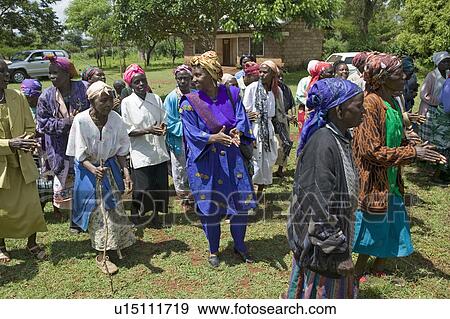Sarah Kilemi, wife of Parliament member Kilemi Mwiria, speaks to "Women without Husbands" women who have been ostracized from society or who have lost their husbands and only have themselves as a group to look after each other in Meru, Kenya, Africa View Large Photo Image Stock Photo - Sarah Kilemi, wife of Parliament member Kilemi Mwiria, speaks to "Women without Husbands" women who have been ostracized from society or who have lost their husbands and only have themselves as a group to look after each other in Meru, Kenya, Africa. Fotosearch