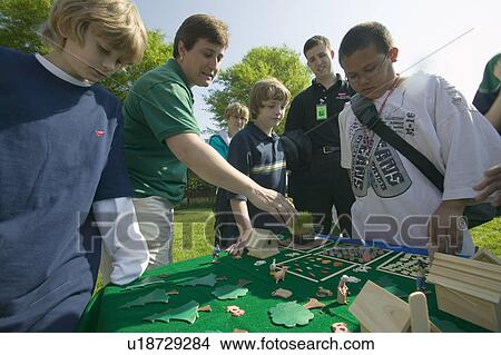 Picture - Students of "Earth Force" build simulated village and farming community during Earth Day event in Alexandria, Virginia. Fotosearch