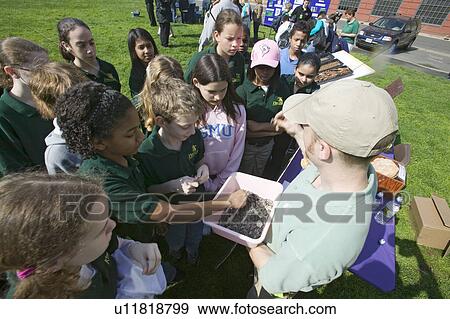 Stock Photo - Students of "Earth Force" environmental group at Earth Day event in Alexandria, Virginia on Potomac River. Fotosearch