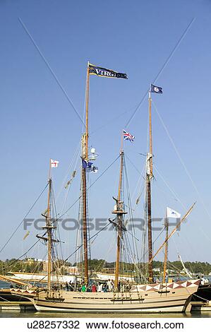 Stock Image - Tallship with Virginia and British flags flying at historic Yorktown, Colonial National Historical Park, Yorktown, Virginia. Fotosearch