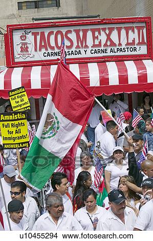 Picture - Taqueria stands in view as hundreds of thousands of immigrants participate in march for Immigrants and Mexicans protesting against Illegal Immigration reform by U. S. Congress, Los Angeles, CA, May 1, 2006. Fotosearch