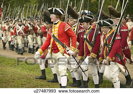 Stock Image - The British march to Surrender Field at the 225th Anniversary of the Victory at Yorktown, a reenactment of the siege of Yorktown, where General George Washington commanded 17, 600 American troops and French Comte de Rochambeau lead 5500 French troops, toge. Fotosearch