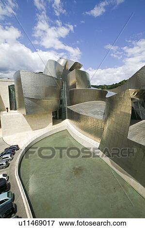Stock Photo - The Guggenheim Museum of Contemporary Art of Bilbao (Bilbo), located on the North Coast of Spain in the Basque region. Nicknamed "The Hole", this is a contemporary museum built of titanium, limestone and glass and was designed by Canadian citizen, Frank O. Fotosearch