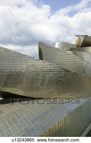 The Guggenheim Museum of Contemporary Art of Bilbao (Bilbo), located on the North Coast of Spain in the Basque region. Nicknamed "The Hole", this is a contemporary museum built of titanium, limestone and glass and was designed by Canadian citizen, Frank O View Large Photo Image Stock Photography - The Guggenheim Museum of Contemporary Art of Bilbao (Bilbo), located on the North Coast of Spain in the Basque region. Nicknamed "The Hole", this is a contemporary museum built of titanium, limestone and glass and was designed by Canadian citizen, Frank O. Fotosearch
