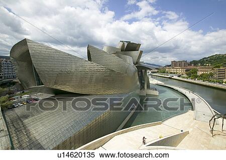 Stock Photography - The Guggenheim Museum of Contemporary Art of Bilbao (Bilbo), located on the North Coast of Spain in the Basque region. Nicknamed "The Hole", this is a contemporary museum built of titanium, limestone and glass and was designed by Canadian citizen, Frank O. Fotosearch
