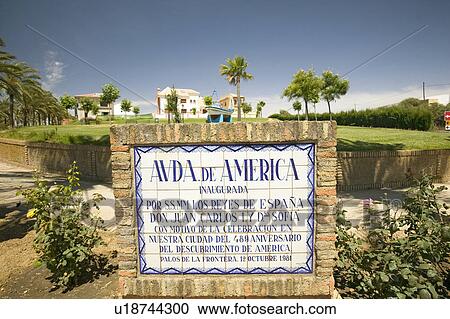 Stock Image - Tile sign along the Avenida de America reads, "Ave. of America inaugurated by HH. MM the sovereigns of Spain Don Juan Carlos I and Dna. Sofia on occasion of the celebration in our city of the 489th anniversary of the discovery of America. Palos de la Front. Fotosearch