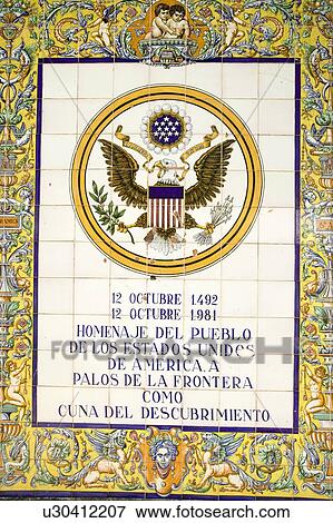 Stock Photo - Tile sign along the Avenida de America reads, "Homage of the people of the United States of America to Palos de la Frontera, cradle of the discovery", Palos de la Frontera, Huelva, Southern Spain. Fotosearch