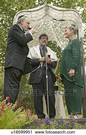 Wedding ceremony under a canopy with Rabbi, bride and groom at a traditional Jewish wedding in Ojai, CA View Large Photo Image Stock Image - Wedding ceremony under a canopy with Rabbi, bride and groom at a traditional Jewish wedding in Ojai, CA. Fotosearch