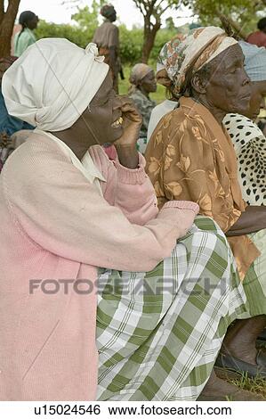 Stock Photograph - Women without Husbands" women who have been ostracized from society or who have lost their husbands and only have themselves as a group to look after each other in Meru, Kenya, Africa. Fotosearch