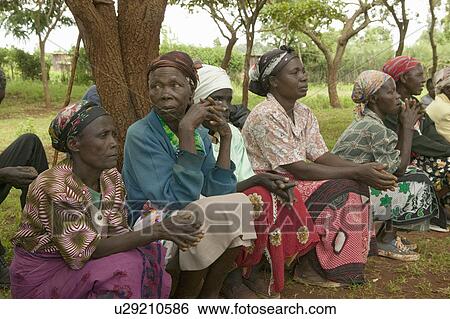 Stock Photograph - Women without Husbands" women who have been ostracized from society or who have lost their husbands and only have themselves as a group to look after each other in Meru, Kenya, Africa. Fotosearch