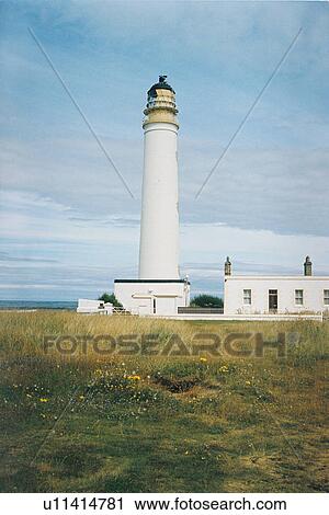 Stock Image - lighthouse located at BarnesNess, Scotland. Fotosearch