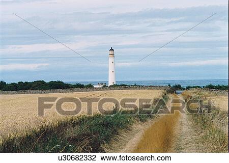 Stock Image - lighthouse located at BarnesNess, Scotland. Fotosearch
