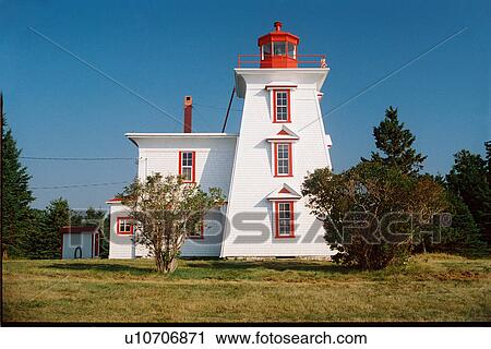 Stock Image - lighthouse located at BlockhousePt, PEI. Fotosearch