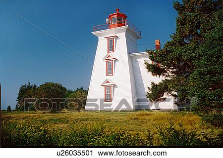 Stock Image - lighthouse located at BlockhousePt, PEI. Fotosearch