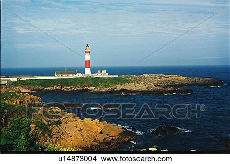Picture - lighthouse located at BuchanNess, Scotland. Fotosearch