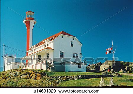 Stock Photo - lighthouse located at Cape Forchu, Nova Scotia. Fotosearch