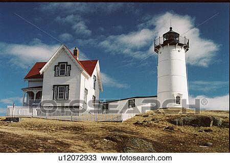 Stock Image - lighthouse located at Cape Neddick, Maine, United States. Fotosearch