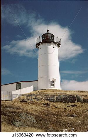 Stock Image - lighthouse located at Cape Neddick, Maine, United States. Fotosearch
