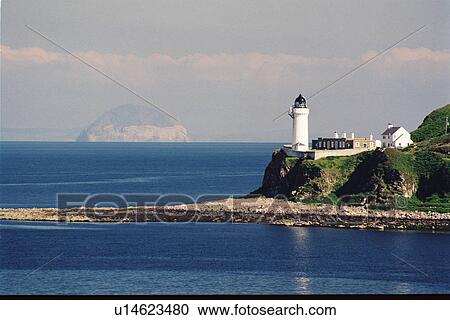 Stock Image - lighthouse located at Davaar Island, Scotland. Fotosearch