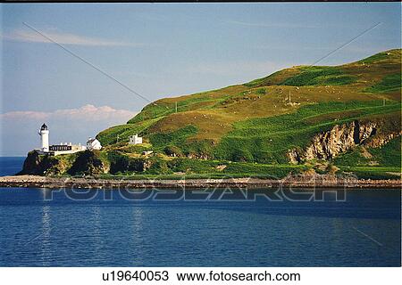 Stock Image - lighthouse located at Davaar Island, Scotland. Fotosearch