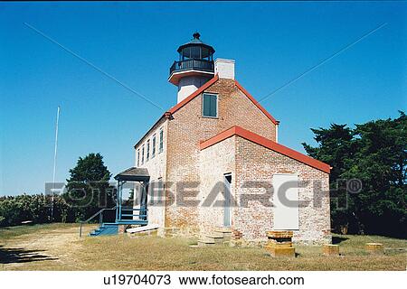 Stock Image - lighthouse located at East Point, New Jersey, United States. Fotosearch