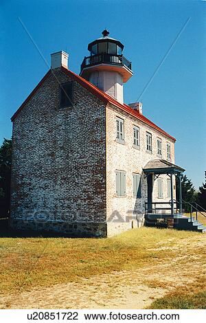 Stock Image - lighthouse located at East Point, New Jersey, United States. Fotosearch