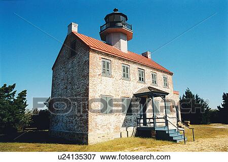 Stock Photo - lighthouse located at East Point, New Jersey, United States. Fotosearch