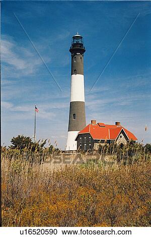Stock Image - lighthouse located at Fire Island, New York, United States. Fotosearch