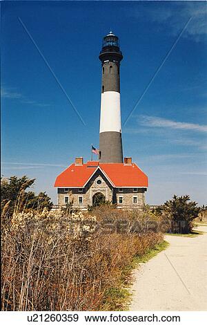 Stock Photo - lighthouse located at Fire Island, New York, United States. Fotosearch