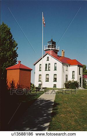 lighthouse located at GrandTraverse, Michigan, United States View Large Photo Image Stock Photograph - lighthouse located at GrandTraverse, Michigan, United States. Fotosearch