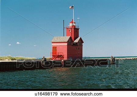 Stock Photo - lighthouse located at Holland Harbor, Michigan, United States. Fotosearch