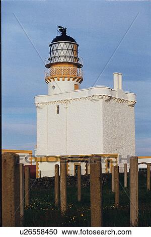 Stock Image - lighthouse located at KinnairdHead, Scotland. Fotosearch