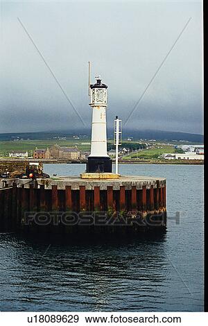 Stock Photo - lighthouse located at Kirkwall Harbor, Scotland. Fotosearch
