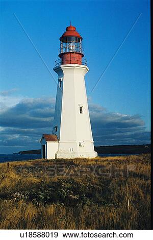 Stock Photo - lighthouse located at Low Point, Nova Scotia. Fotosearch