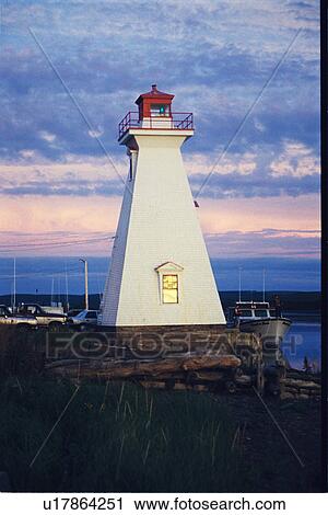 Stock Image - lighthouse located at Mabou Harbor, Nova Scotia. Fotosearch