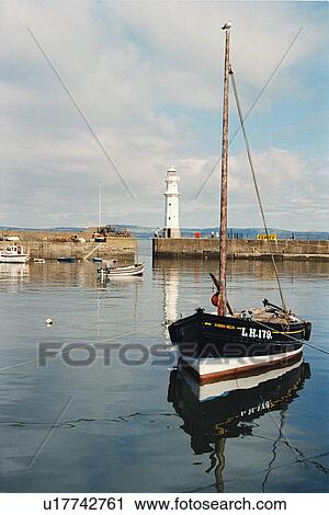 Stock Image - lighthouse located at NewHavenHarbour, Scotland. Fotosearch